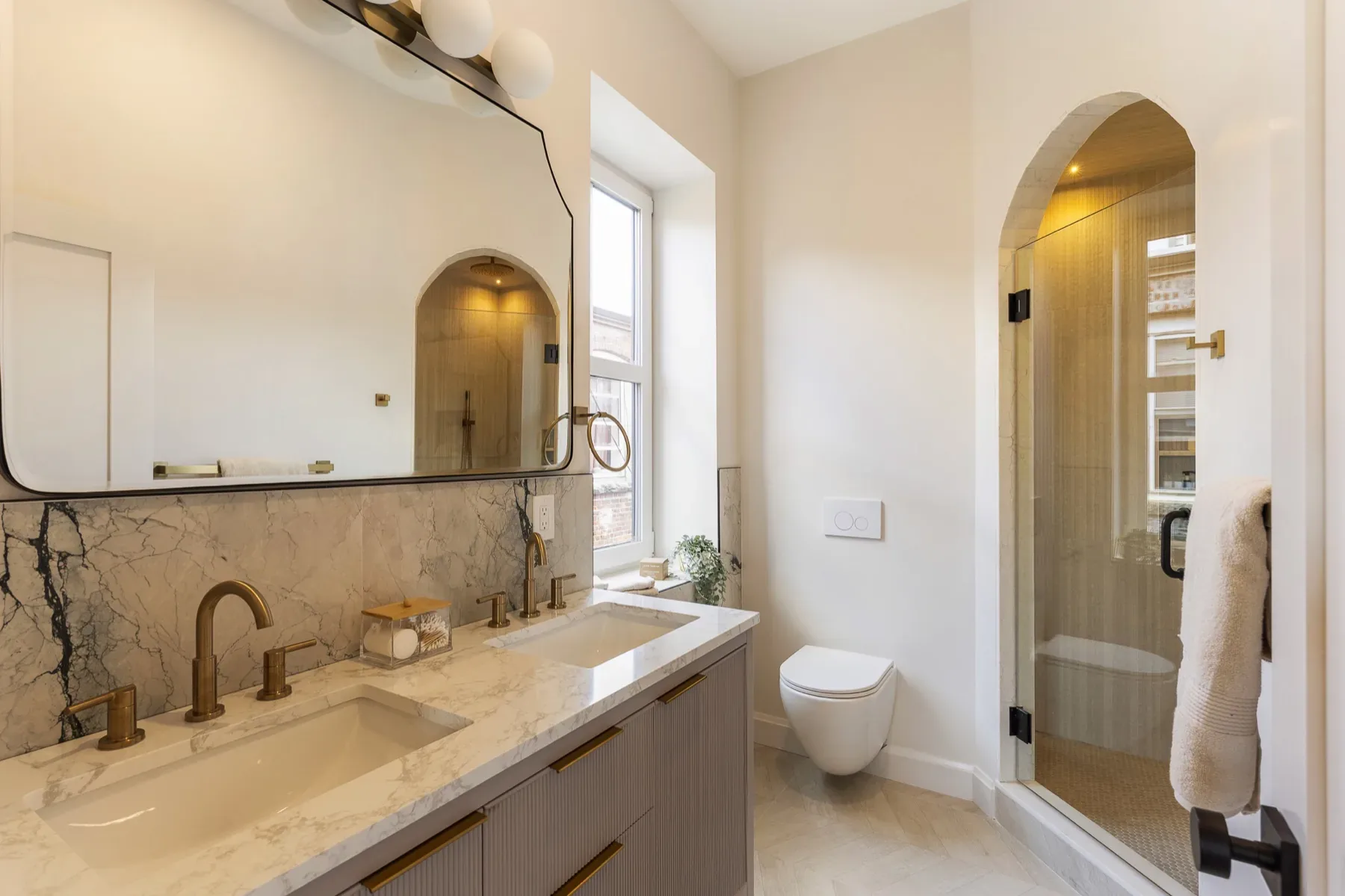 Finished primary bathroom with refined materials