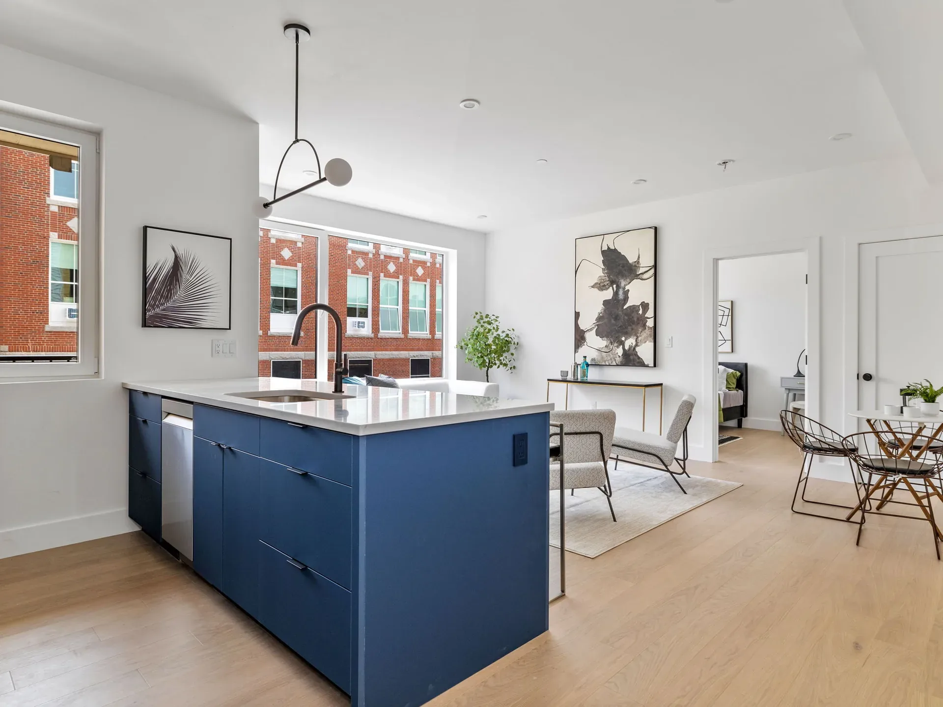 Blue kitchen island and open living area